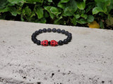 Unisex Red Skulls and Lava Stone Bracelet